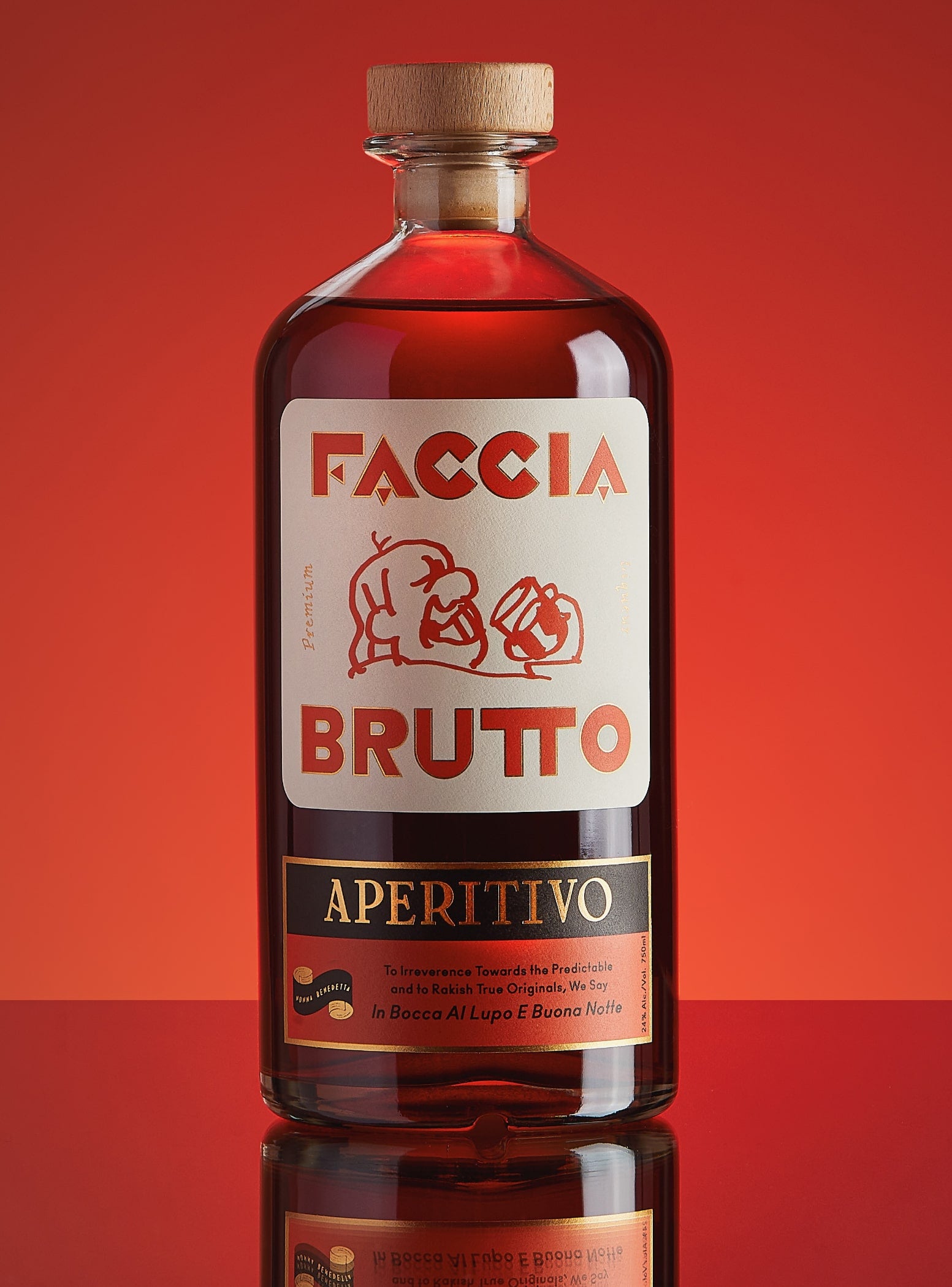 Cocktail on the rocks with orange peel and bottle of Faccia Brutto Aperitivo