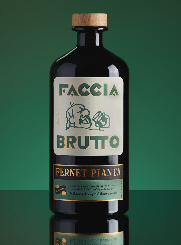 Front of Faccia Brutto Fernet Pianta bottle with dark green background